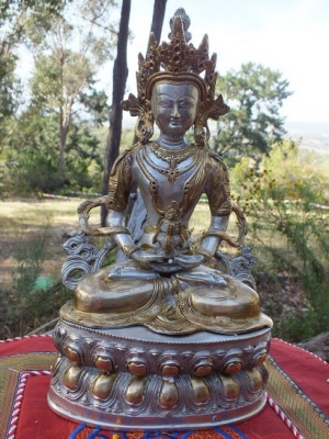 Amitabha brass with silver and gold.